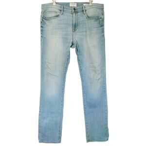 FRAME Denim L'Homme Slim fit distressed mid rise straight tapered jeans Finn 36
